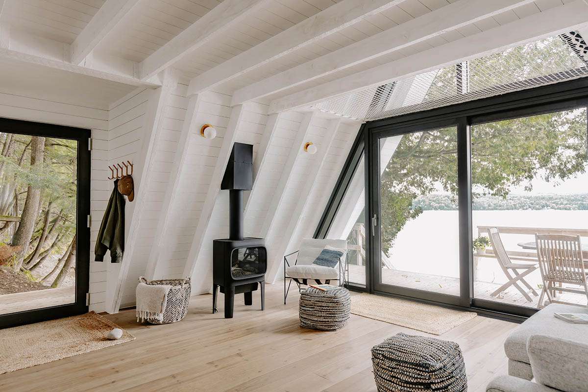Small A-frame cottage design enhances the feeling of relaxation overlooking the lake