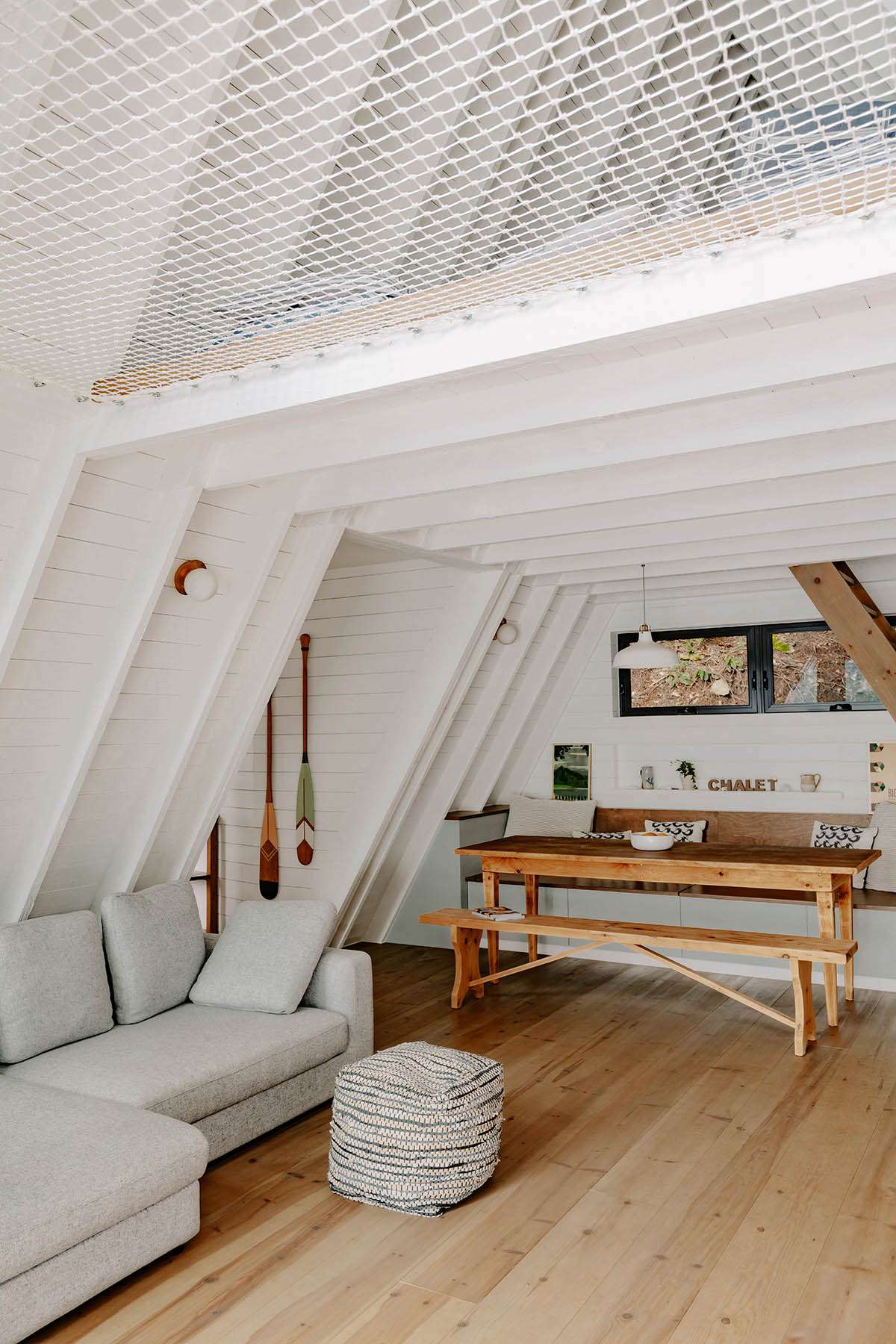 Small A-frame cottage design enhances the feeling of relaxation overlooking the lake