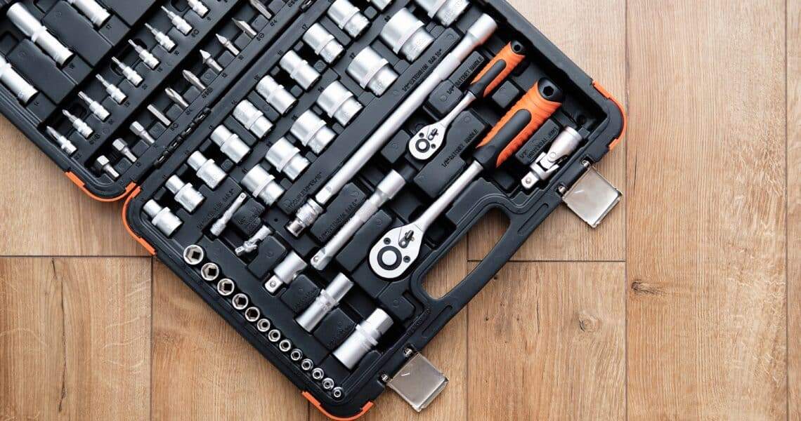 Tool kit for the car. Set of tools for repair on wooden background. Repair and maintenance concept