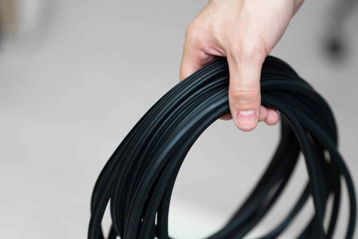 12 Best Garage Door Seals Of 2022 14 Professional window repair and installation technician holding a rubber gasket for pvc windows in his hand