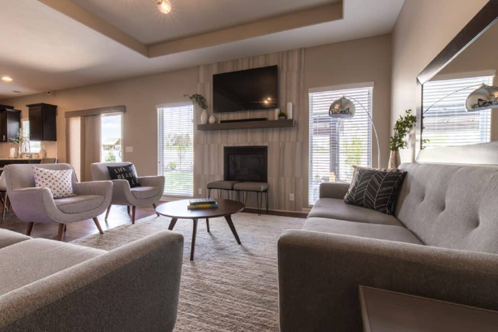 "A transitional living room design blending classic and modern elements with neutral colors and warm accents."