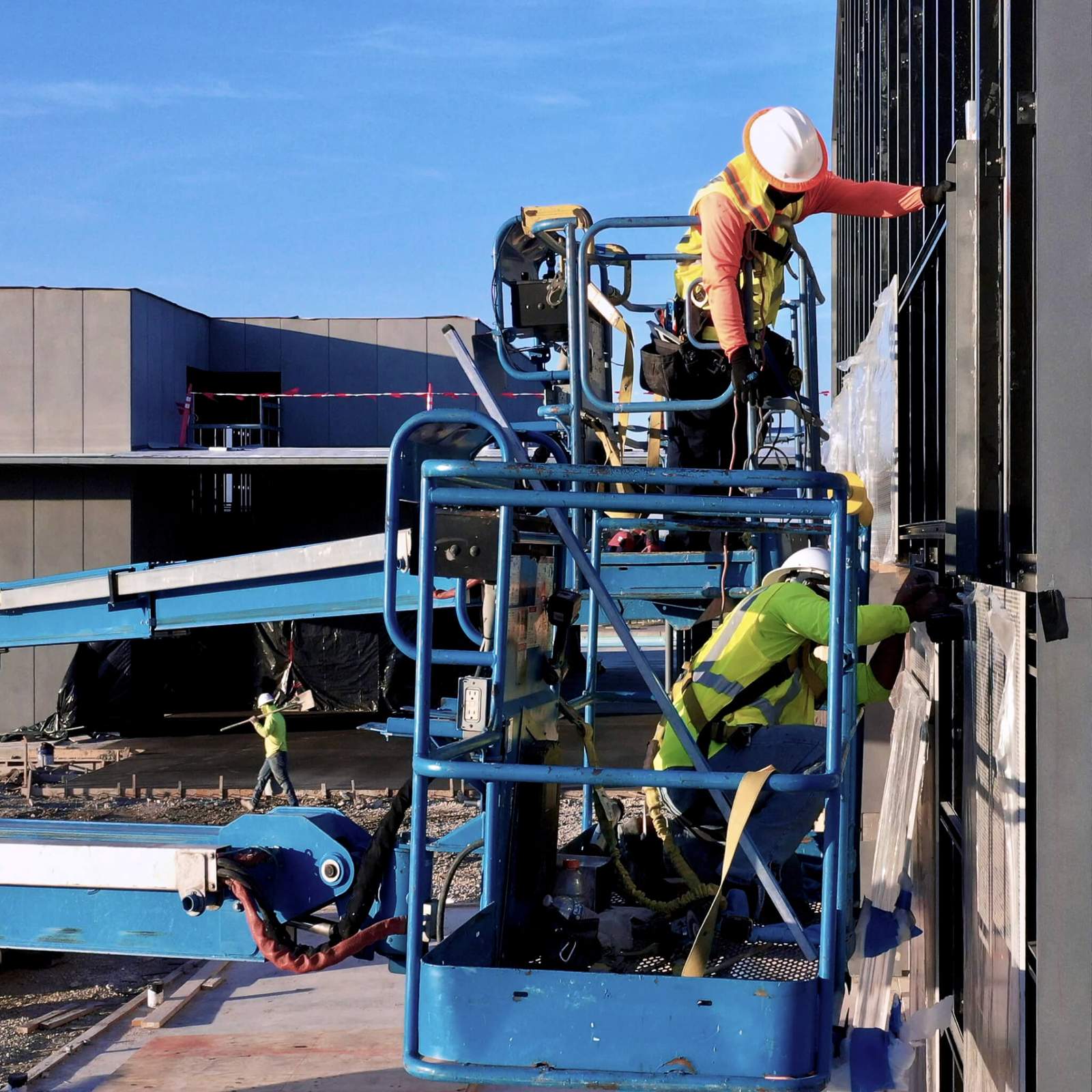Contractors installing a facade