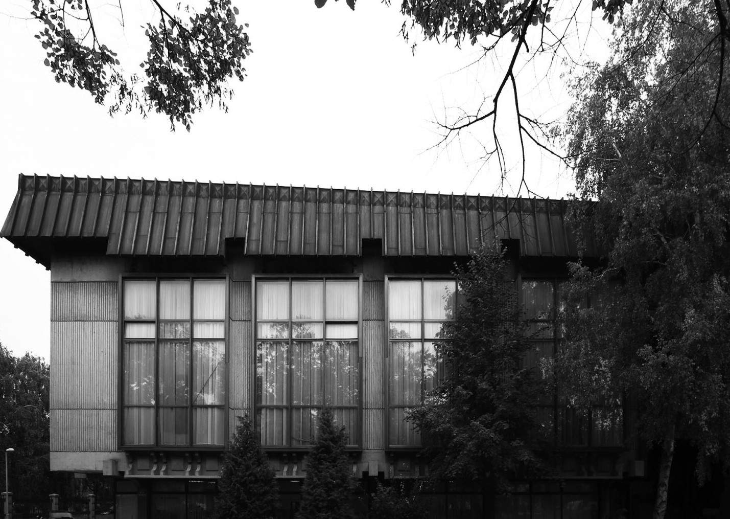 The concrete and glass rear side of the building.