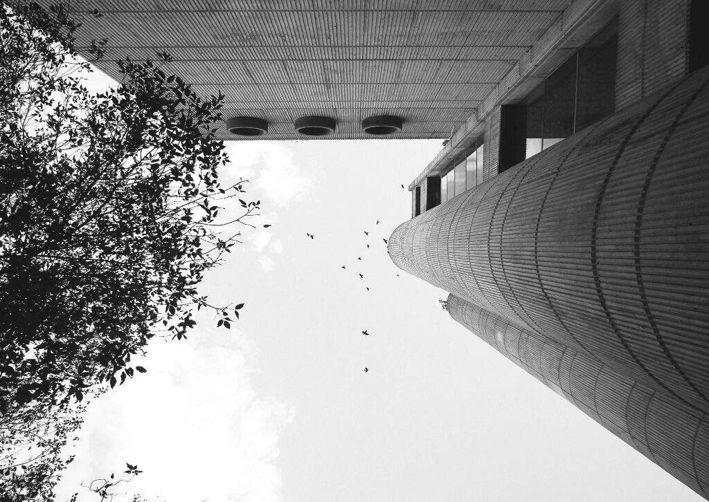 An upwards view of the Telecommunication center's tower and block.