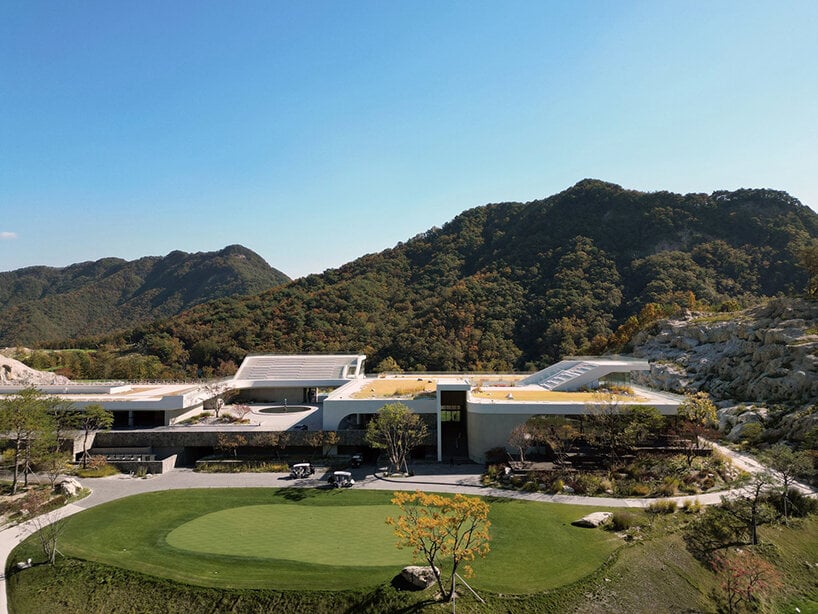 LESS architects weaves new clubhouse into the hilly landscape of wonju in south korea