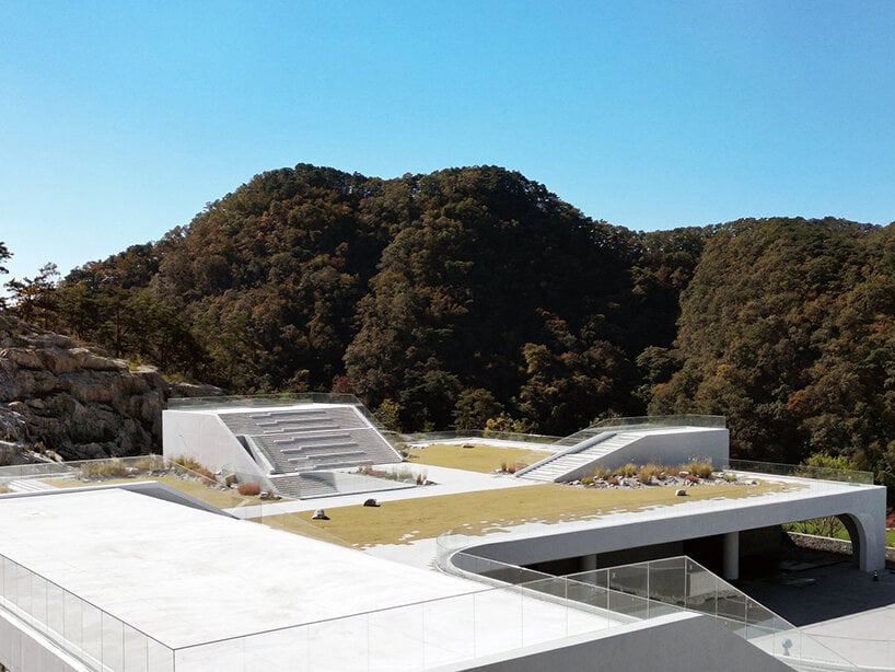 LESS architects weaves new clubhouse into the hilly landscape of wonju in south korea