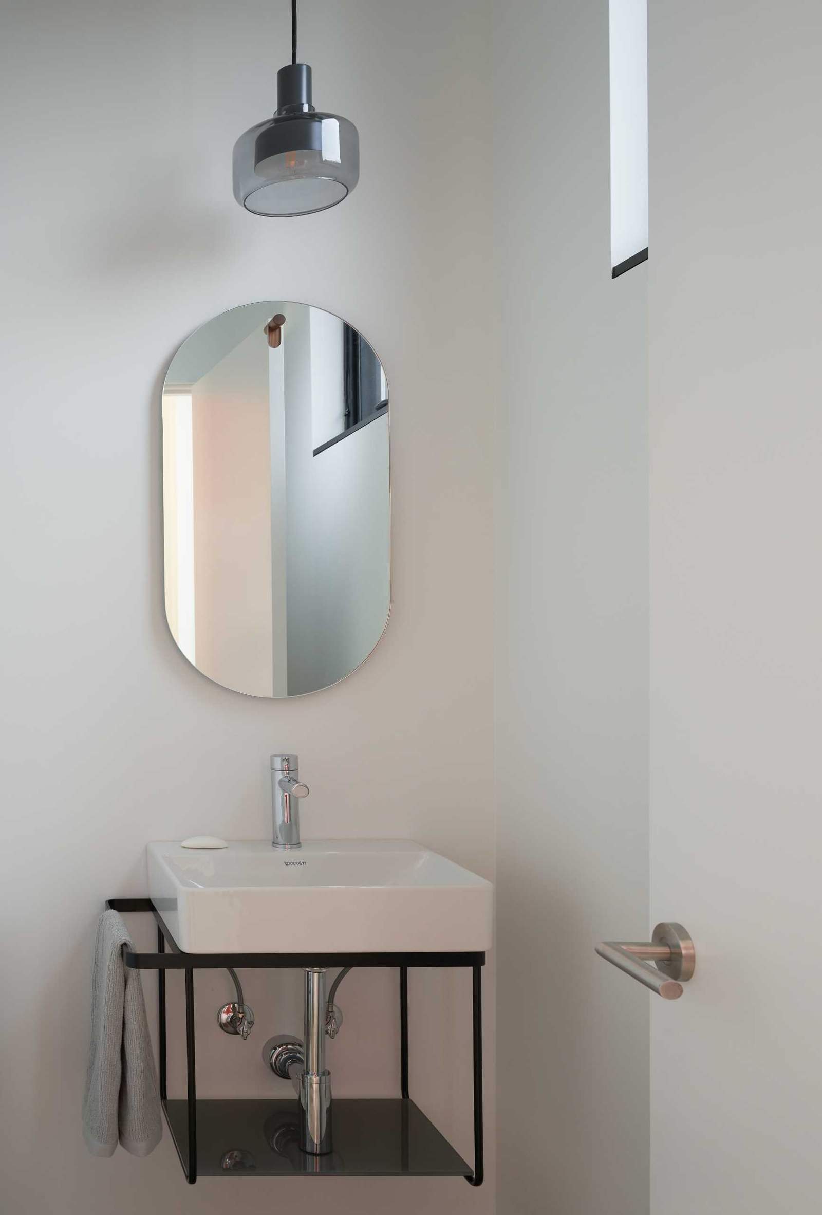 A powder room with a minimalist design.