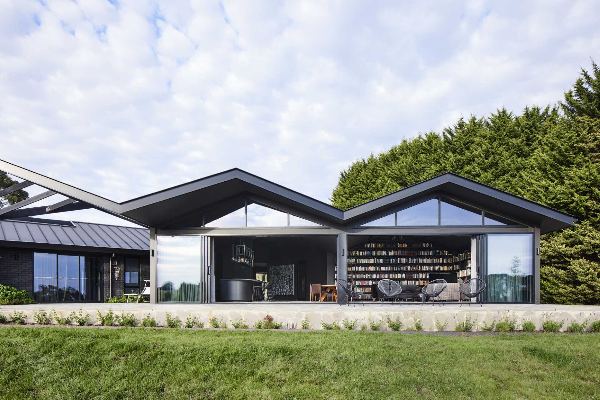 Pitched Roofs Cover This Dark And Moody Farmhouse 