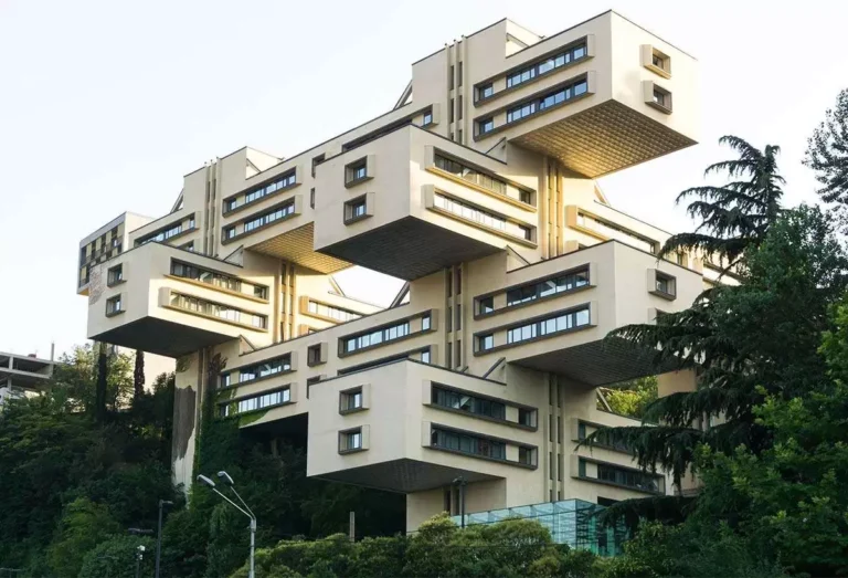 A building showcasing the simple and distinctive geometric design of Brutalist architecture, featuring raw materials like concrete.
