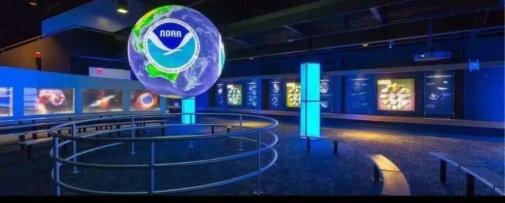 "An interactive exhibition space featuring digital screens and a large globe to deliver innovative educational experiences."