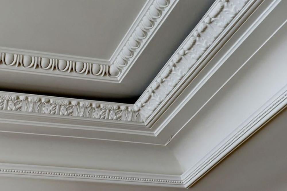 "Wall decorations made of stucco showcasing intricate circular patterns and geometric designs."