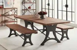 Dining table with wood top and metals in furniture base indoors