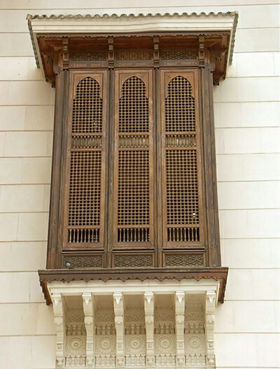 Traditional wooden latticed windows showcasing the beauty of natural materials in interior design."