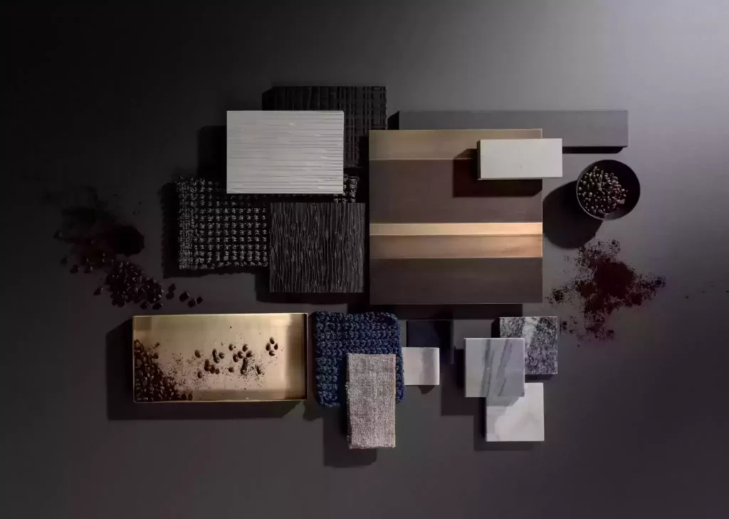 "A variety of interior design materials showcasing different textures and finishes used in decor, including wood, fabric, and glass."
