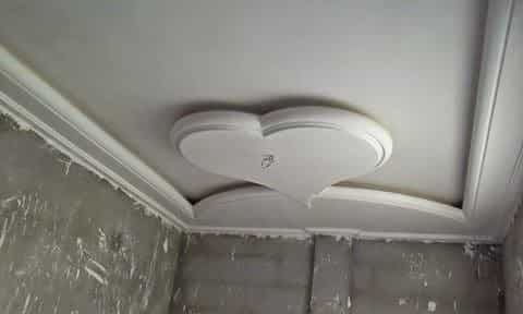 "Wall decoration made of stucco showcasing a precise heart-shaped geometric design."