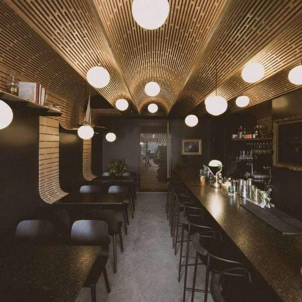 Studio North adds plywood barrel vaults to Business & Pleasure bar