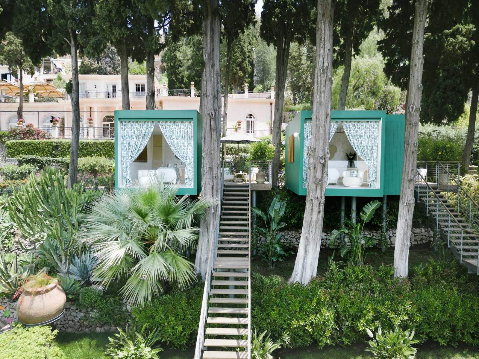 A Pair Of Wellness Cabins Perched Among The Trees