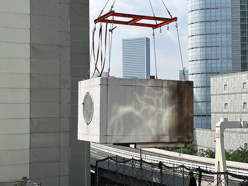 a capsule from tokyo's demolished nakagin capsule tower is landing at SFMOMA