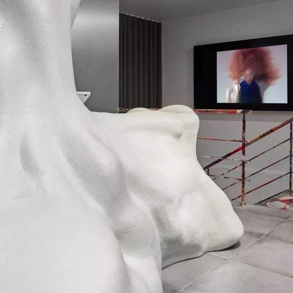 Blobby sculpture functions as cash desk inside Rains’ Aarhus boutique