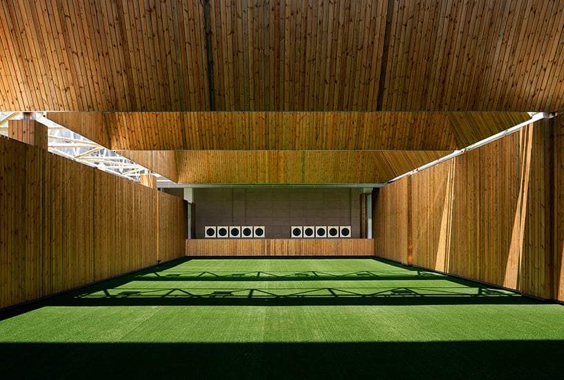 UAD affixes sun-powered rotating louvers on sports center's modular facade in hangzhou