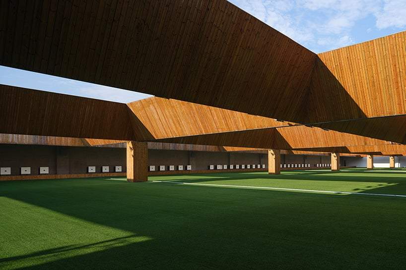 UAD affixes sun-powered rotating louvers on sports center's modular facade in hangzhou