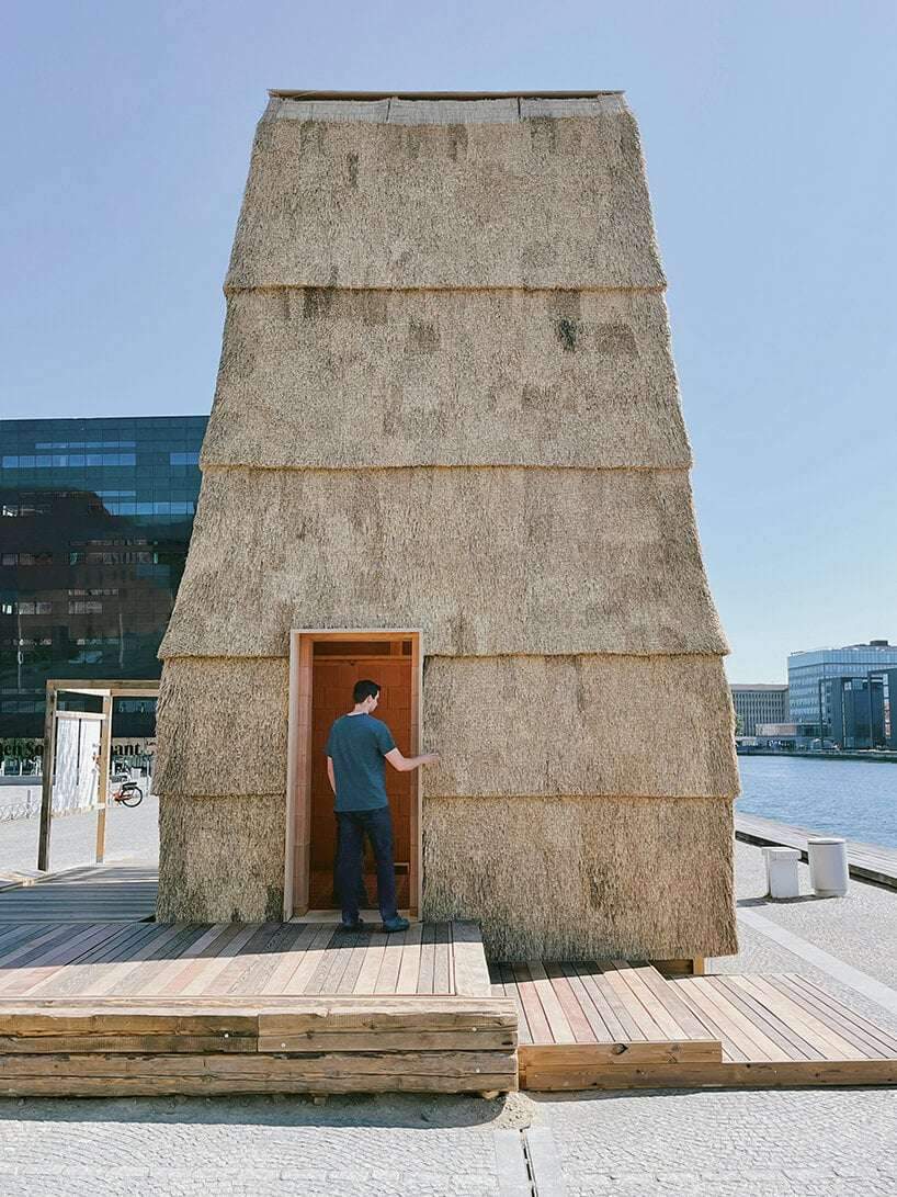 low-carbon & fire-resistant pavilion in copenhagen features a thatched brick shell