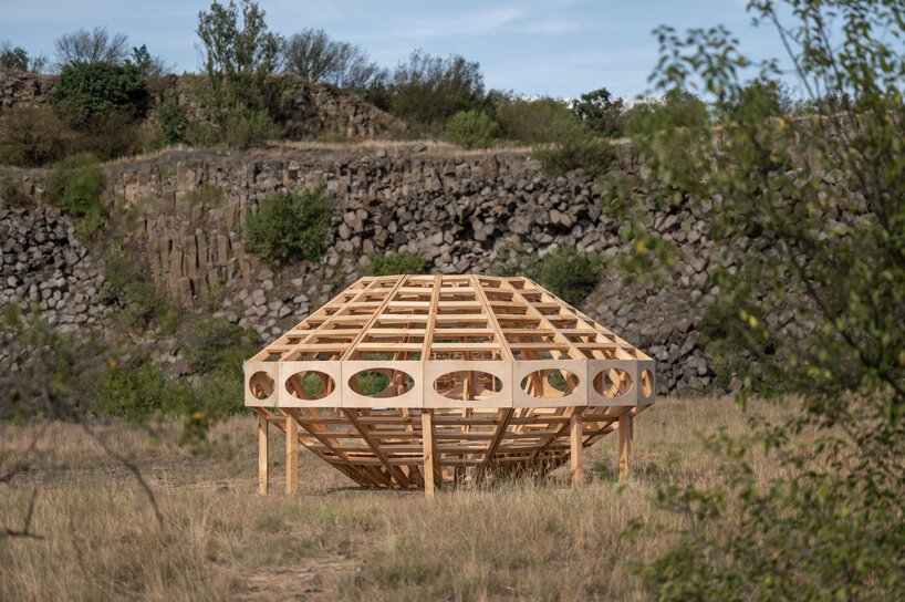 spaceship earth timber installation lands at hello wood festival in hungary