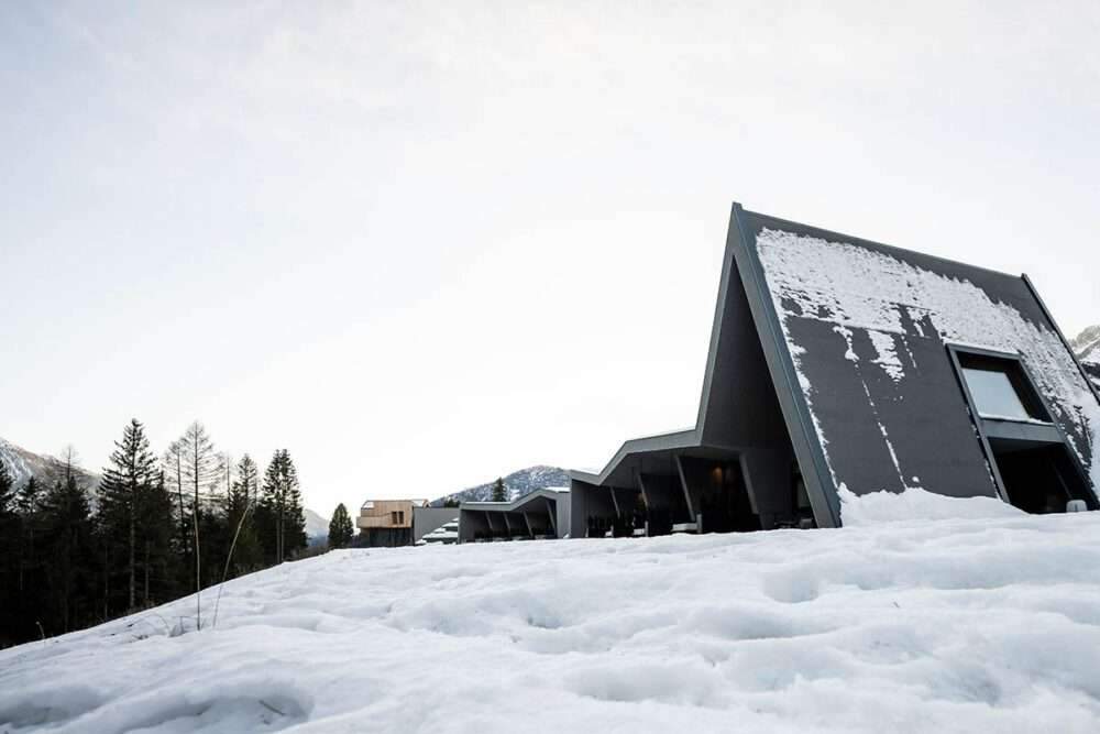 The choice of zigzag ceiling defines the character of the Olympic Spa By NOA Hotel in an alpine meadow