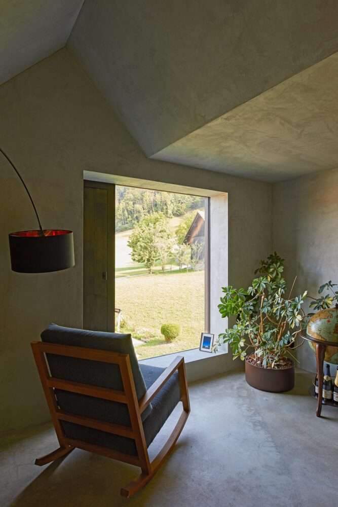 Residential barn featuring an unfinished interior in the Swiss rural landscape