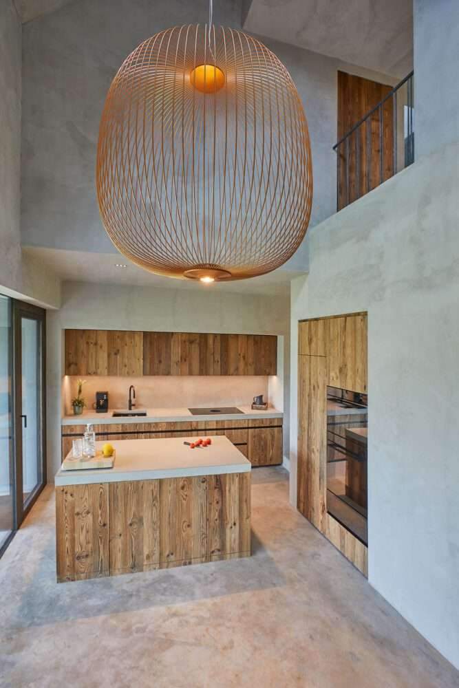 Residential barn featuring an unfinished interior in the Swiss rural landscape