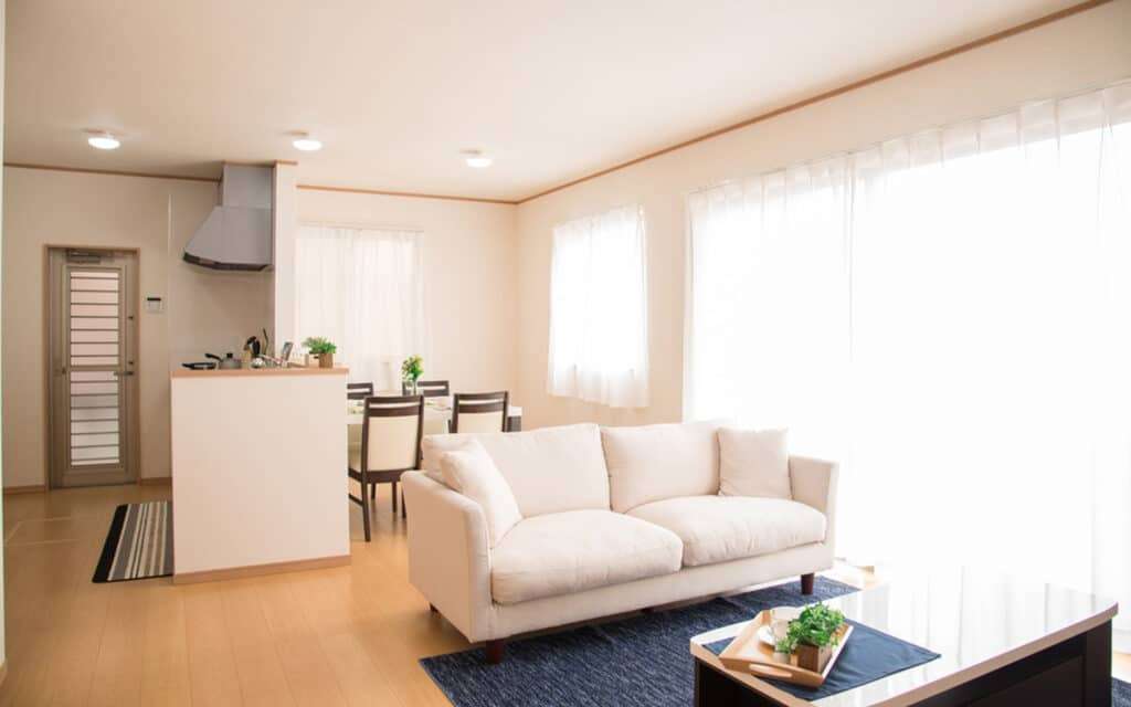 Modern living room with large windows supporting natural ventilation