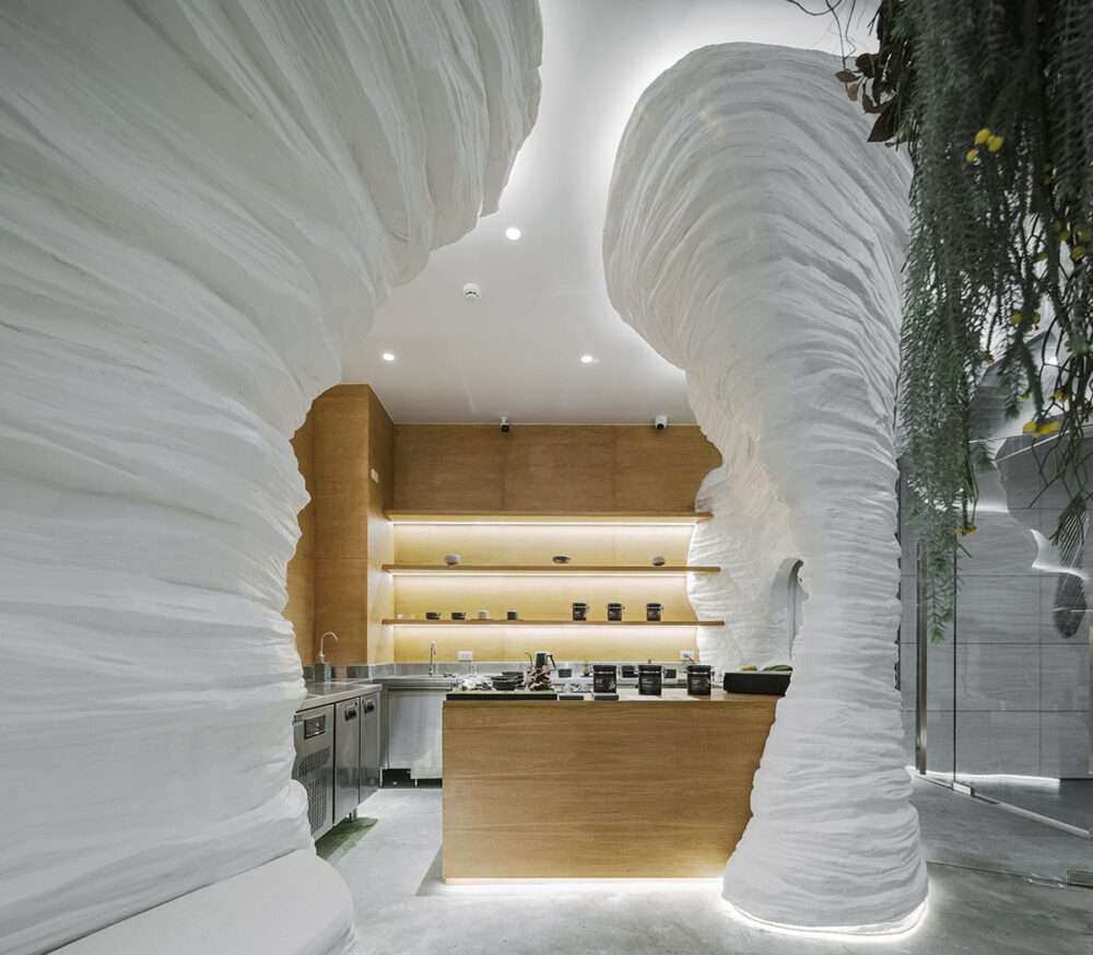 The design of the tea café within the cave-like walls has a surreal atmosphere