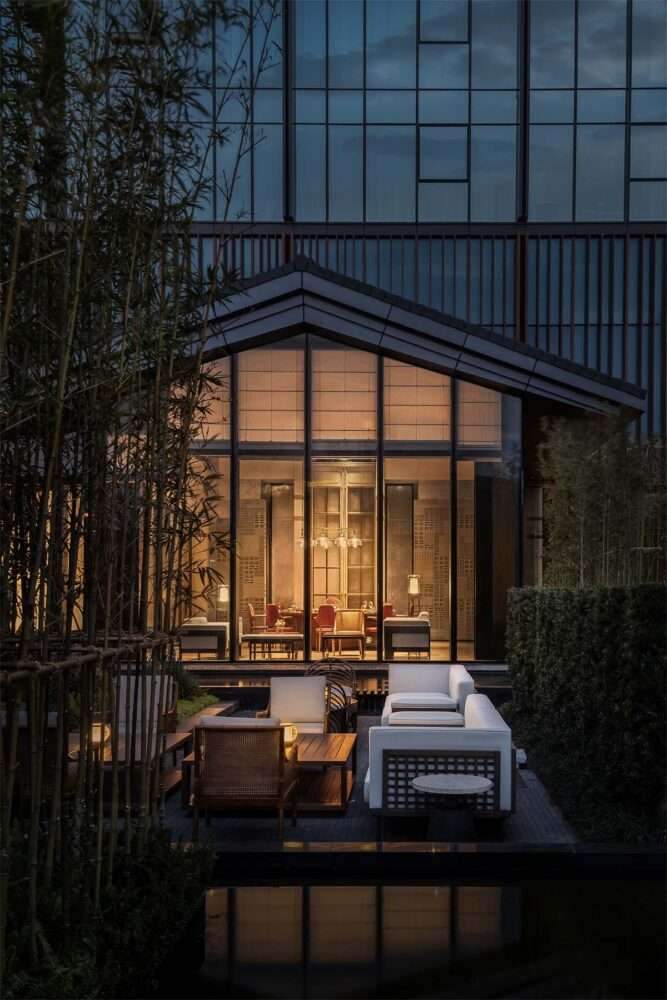Create interiors for Mumian Chengdu Hotel with oriental architectural elements in China