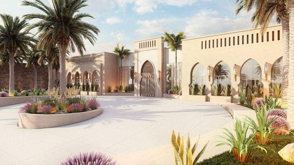 Entrance of a building in Salman Style with gardens and palm trees
