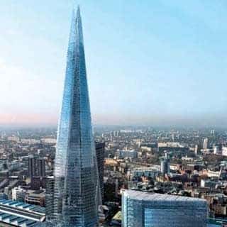 "The Shard illuminates the cityscape behind it, with a view of surrounding urban landmarks