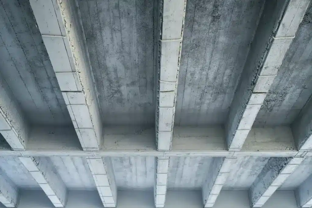  Raw concrete wall showing the imprints of the formwork used during casting, exemplifying the concept of Béton Brut.