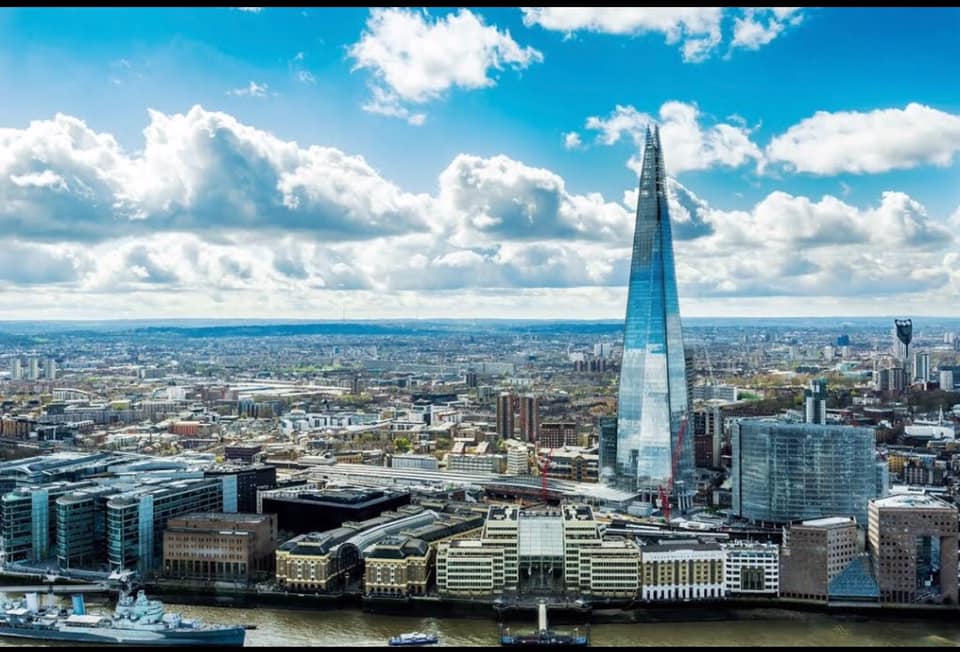 "A panoramic view of London with The Shard standing tall as an urban icon in the sky