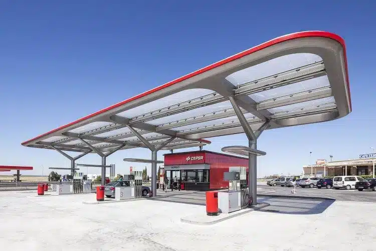 Modern gas station with a large canopy providing shade and protection from weather elements.