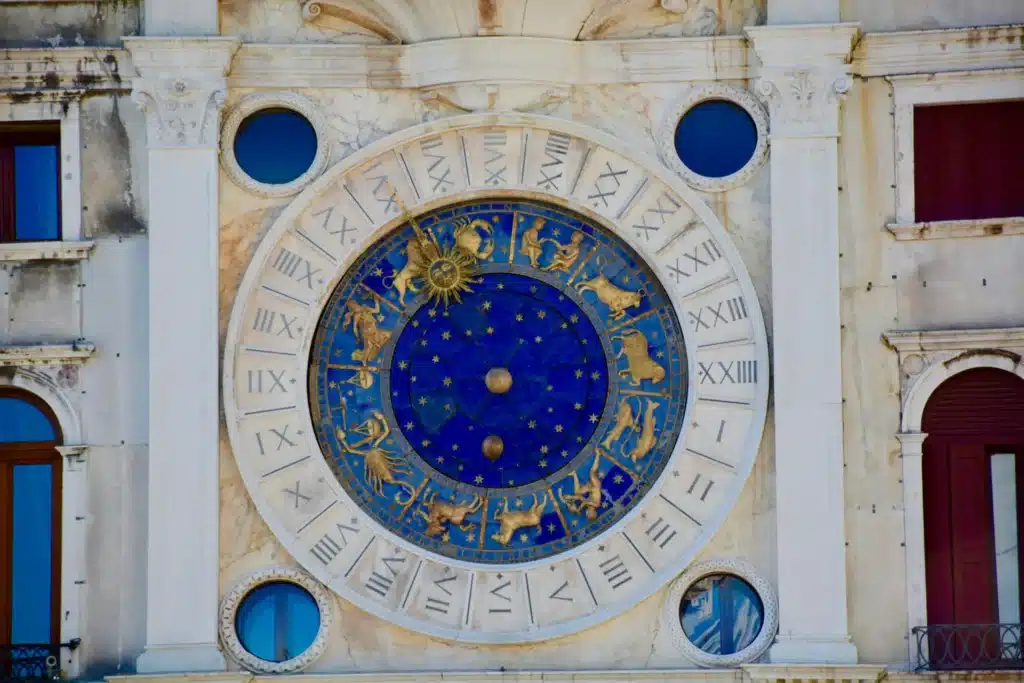 "Astrological zodiac panel on a building wall showcasing the connection between astrology and architectural design"