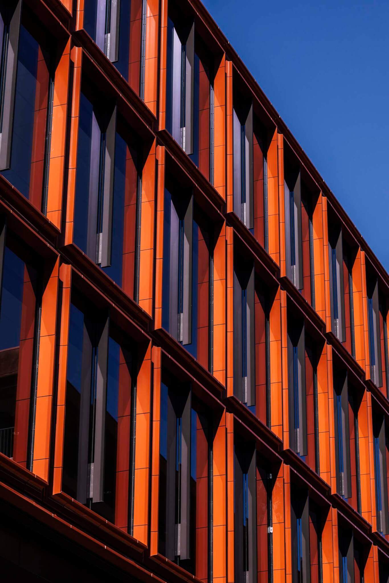 a close-up of the terra-cotta panels on the exterior of the building by Woods Bagot