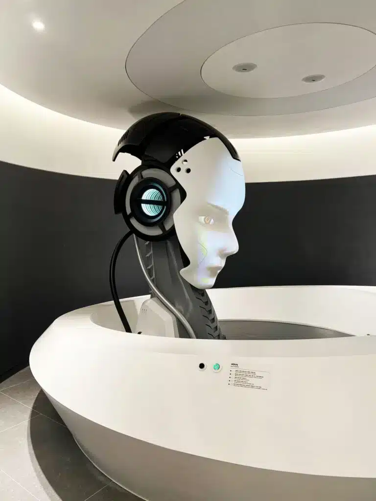 "Reception robot at the Seoul Robot Museum, featuring a modern design with glowing eyes."