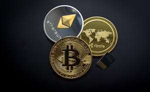 A striking image of Bitcoin, Ethereum, and Ripple coins illustrating modern digital currency.