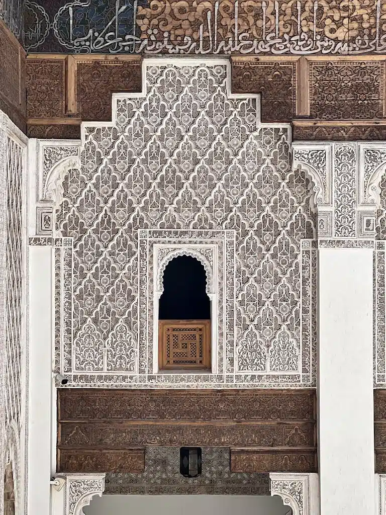 Explore ornate Moroccan architecture with detailed carvings and Islamic patterns.