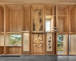 Tek&alpha;k&alpha;pimək Contact Station made of wood and among dense trees in a rural location