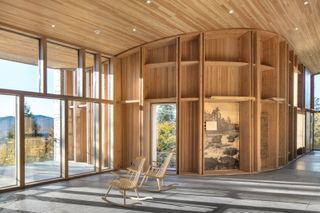 Tek&alpha;k&alpha;pimək Contact Station made of wood and among dense trees in a rural location