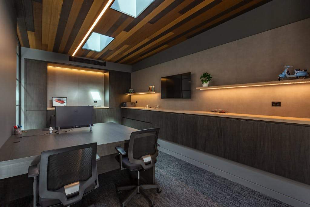 Stylish and contemporary office interior with chic furniture and ambient lighting.