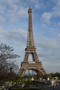 Capture of the iconic Eiffel Tower under a serene blue sky in Paris, France.