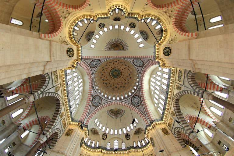 Gorgeous view of the Suleymaniye Mosque's intricately designed dome, showcasing Ottoman architecture.