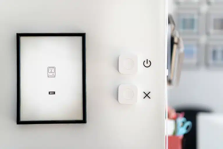Modern minimalist interior featuring smart home devices and framed art for contemporary design aesthetics.