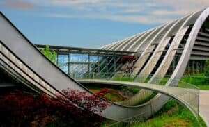 "Suspended structures in modern architecture showcasing the efficient use of cables and membranes to cover large areas."